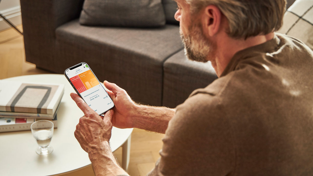 Man checking the healthier air with his smartphone